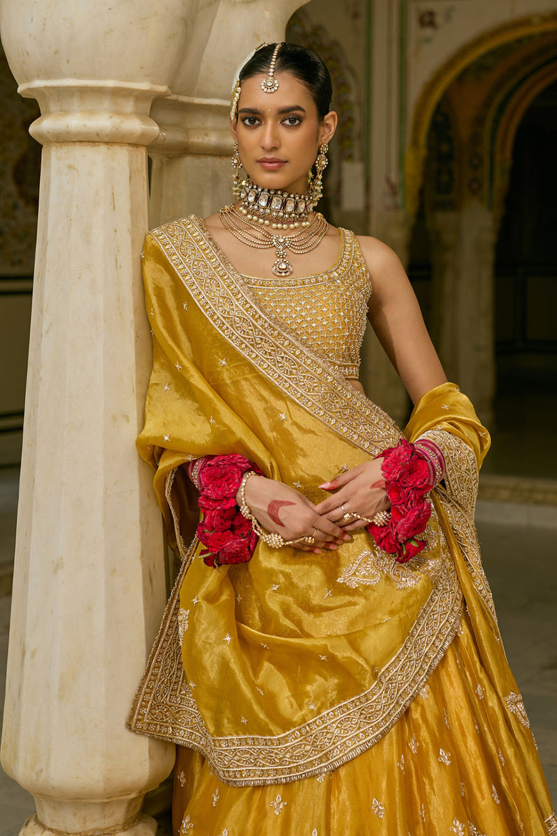 Aashina  - Dabka Zardozi Embroidered Pure Tissue Mustard Lehenga Set