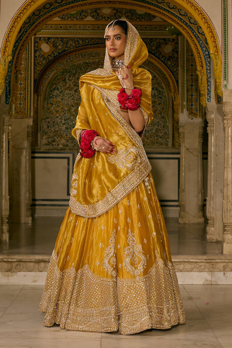 Aashina  - Dabka Zardozi Embroidered Pure Tissue Mustard Lehenga Set
