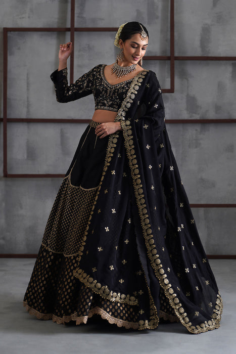 Black embroidered blouse and brocade lehanga
