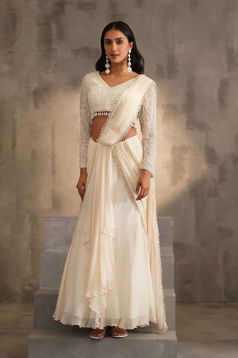 Off white blouse and drape saree