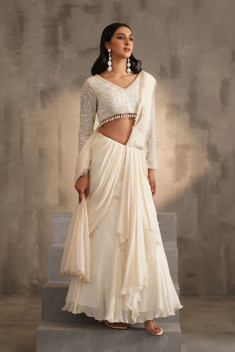 Off white blouse and drape saree