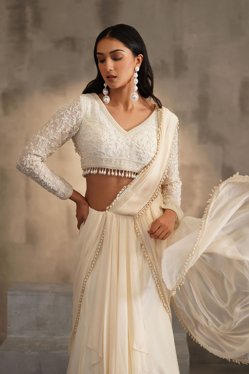 Off white blouse and drape saree