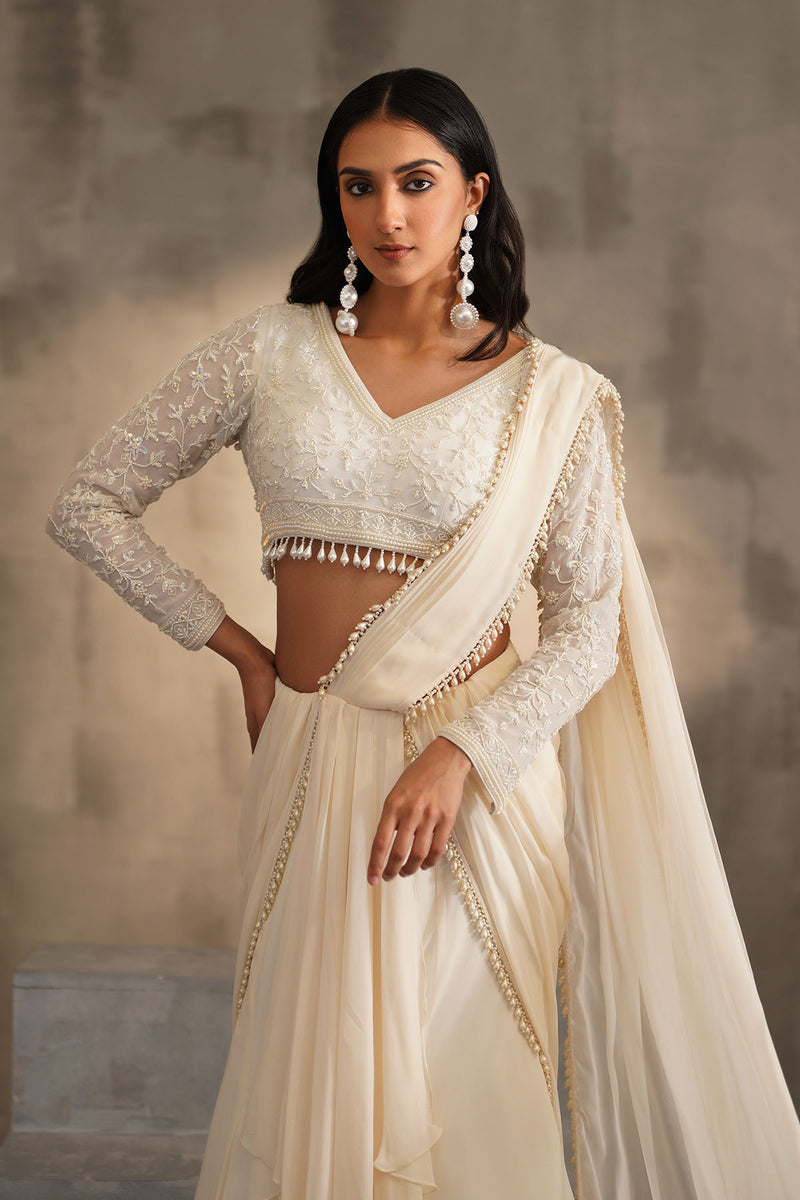 Off white blouse and drape saree