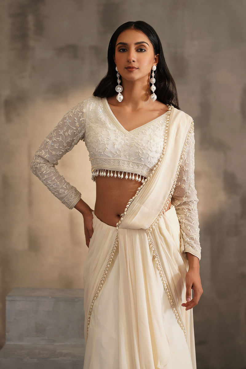 Off white blouse and drape saree