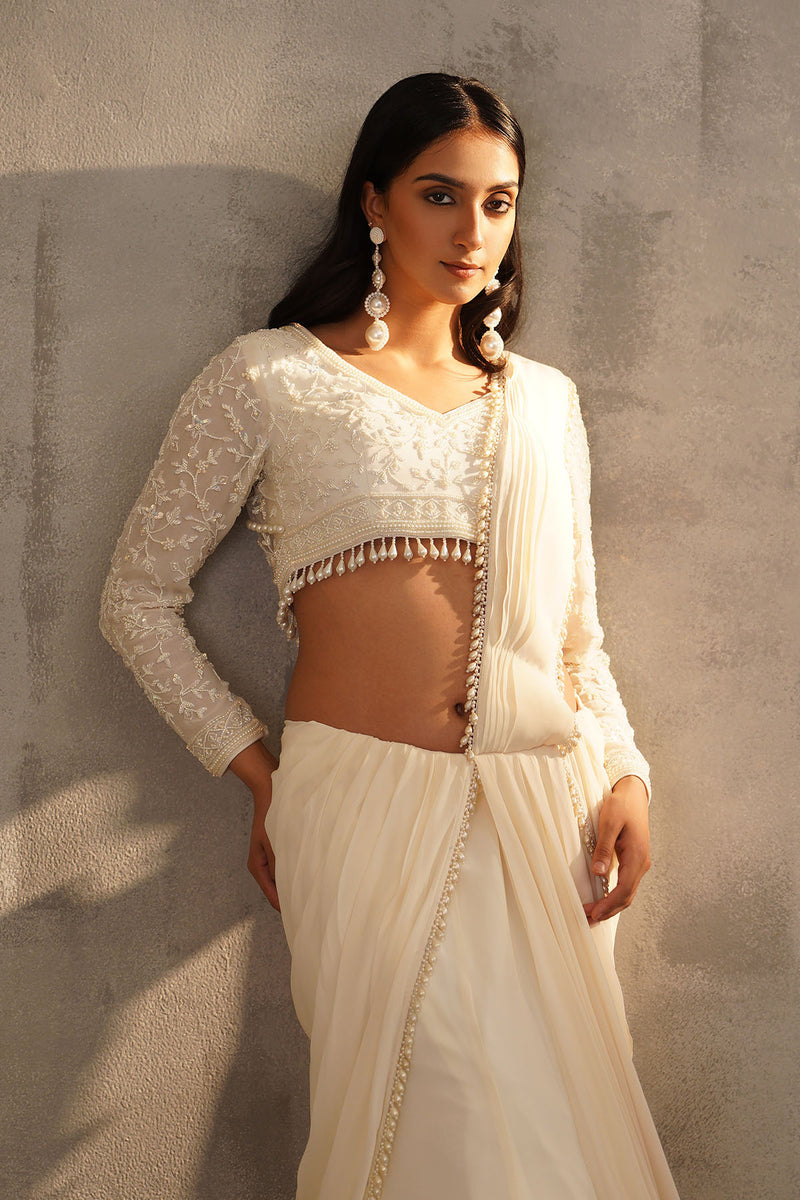 Off white blouse and drape saree
