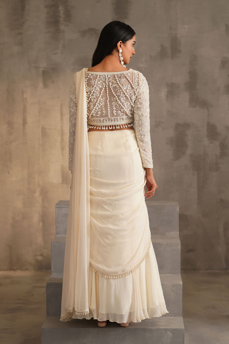 Off white blouse and drape saree