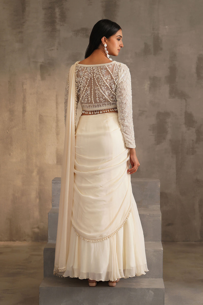 Off white blouse and drape saree