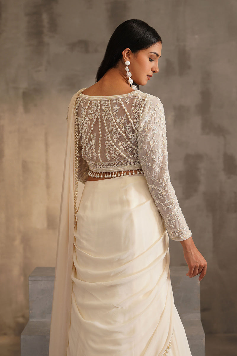 Off white blouse and drape saree