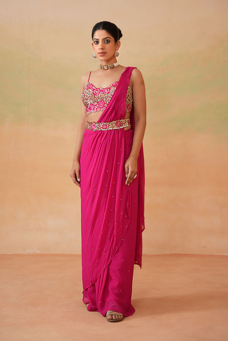 Fuchsia embroidered blouse, drape saree, belt