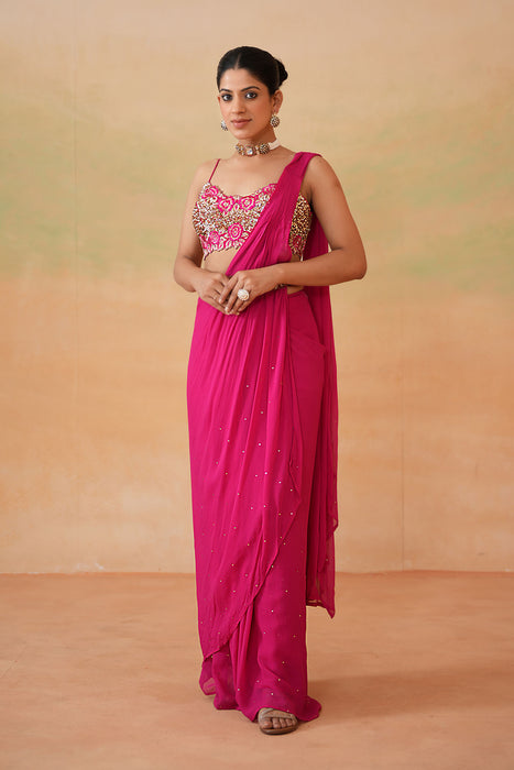 Fuchsia embroidered blouse, drape saree, belt