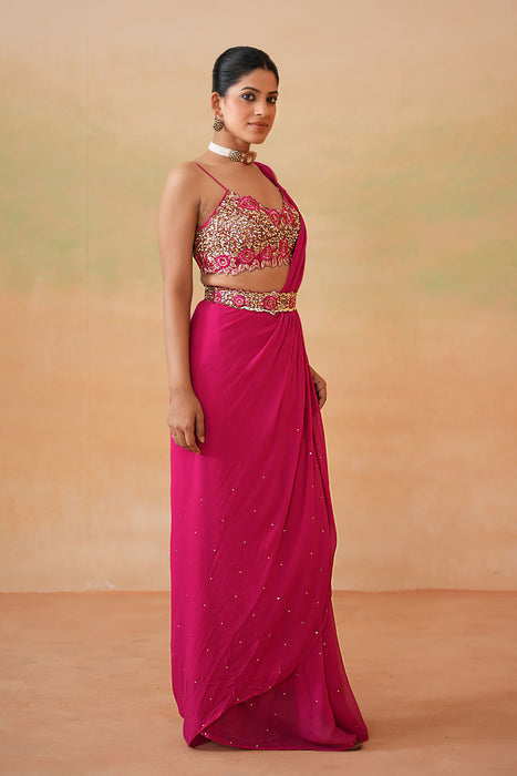 Fuchsia embroidered blouse, drape saree, belt