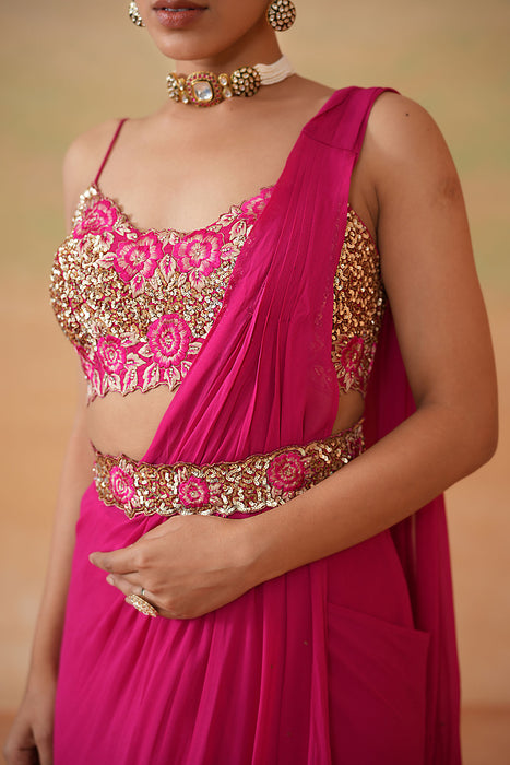 Fuchsia embroidered blouse, drape saree, belt