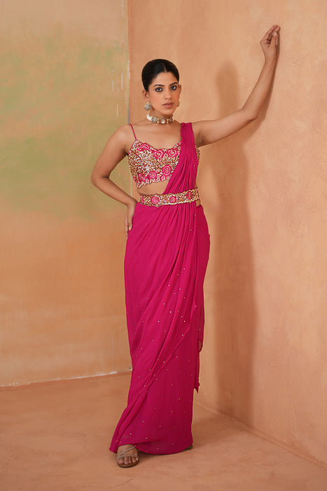 Fuchsia embroidered blouse, drape saree, belt