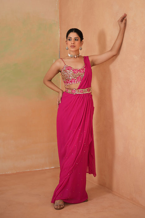 Fuchsia embroidered blouse, drape saree, belt
