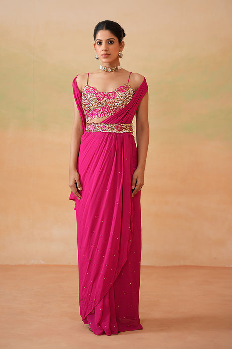 Fuchsia embroidered blouse, drape saree, belt