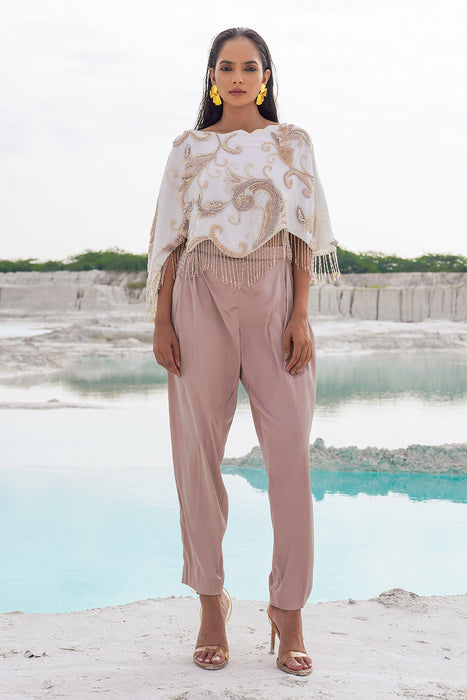 white crop blouse with pleated trousers