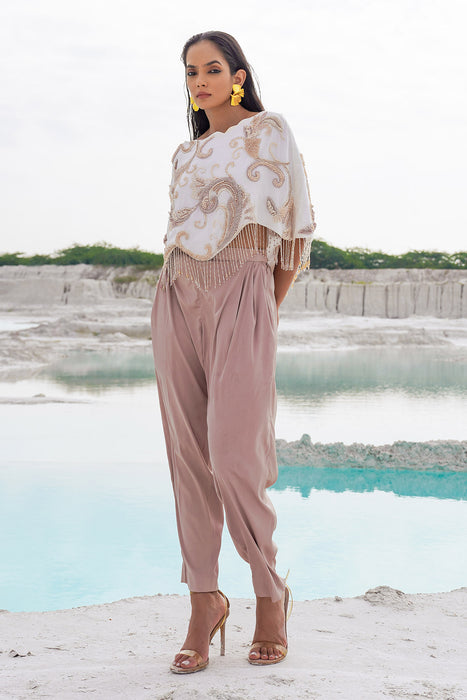 white crop blouse with pleated trousers
