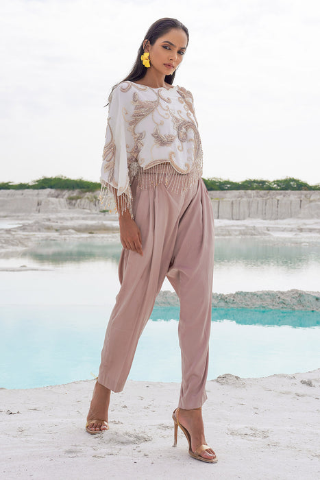 white crop blouse with pleated trousers