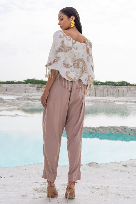 white crop blouse with pleated trousers