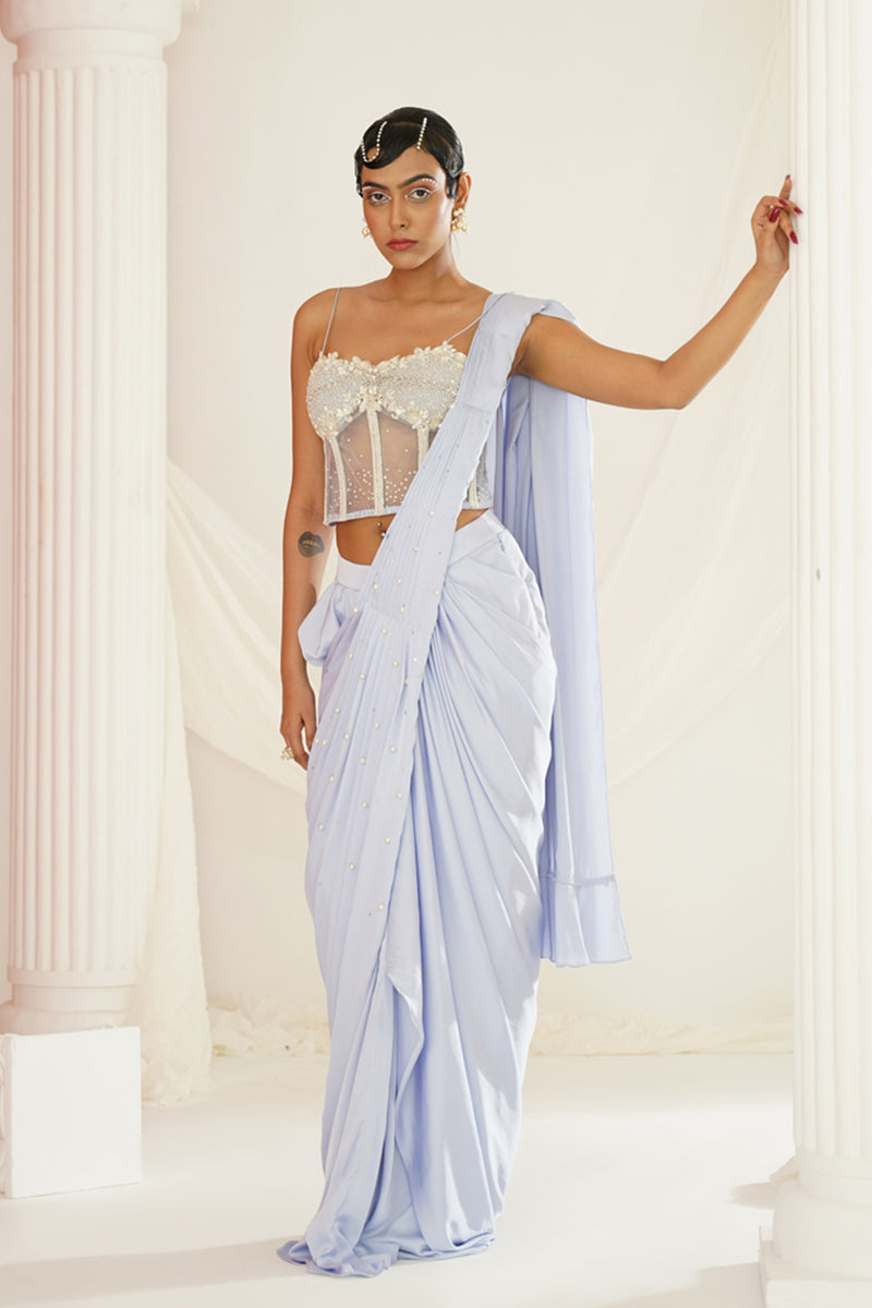 Powder blue embroidered corset blouse with
 ready to wear drape saree set