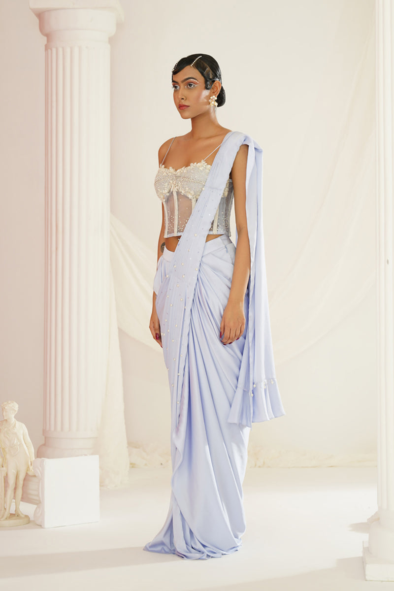 Powder blue embroidered corset blouse with
 ready to wear drape saree set