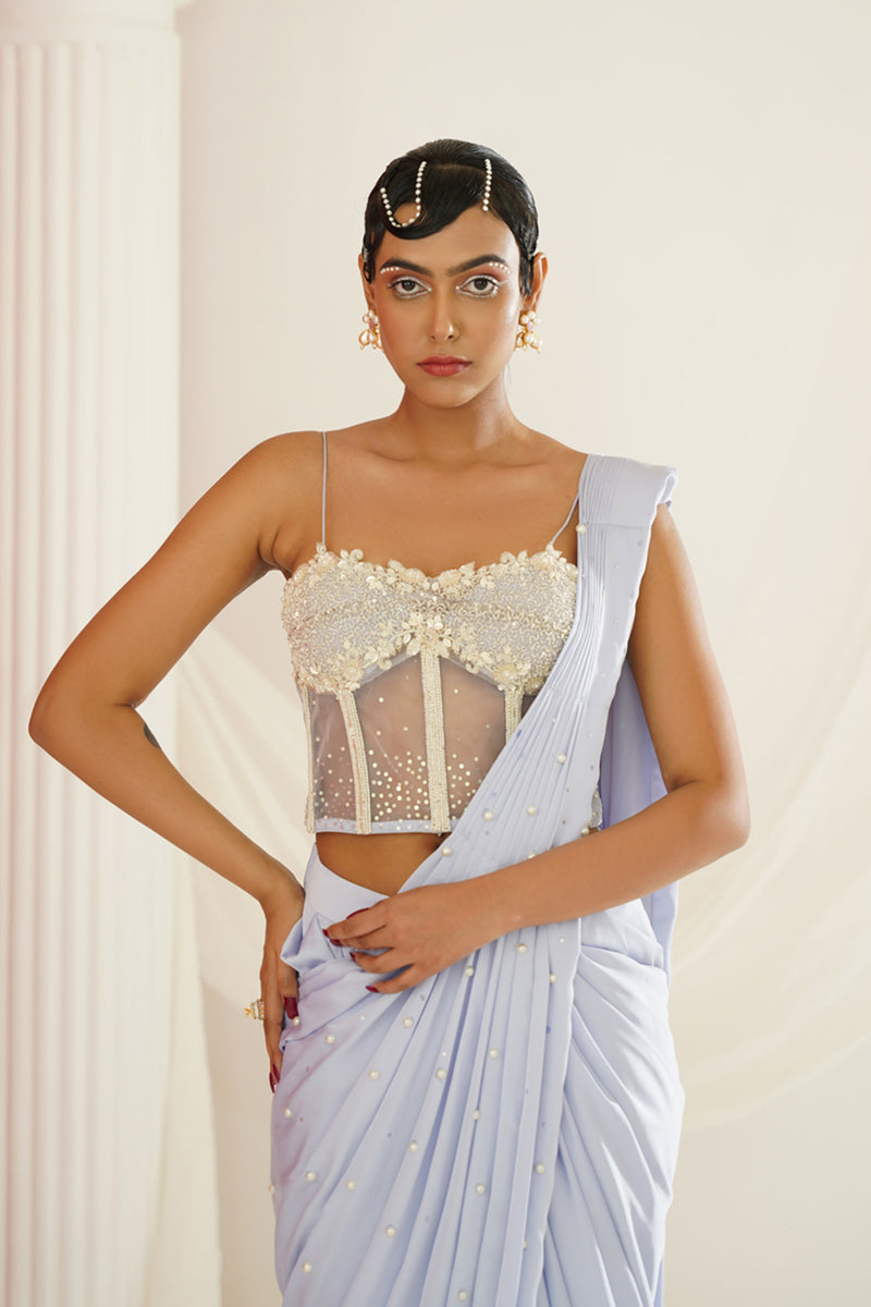 Powder blue embroidered corset blouse with
 ready to wear drape saree set