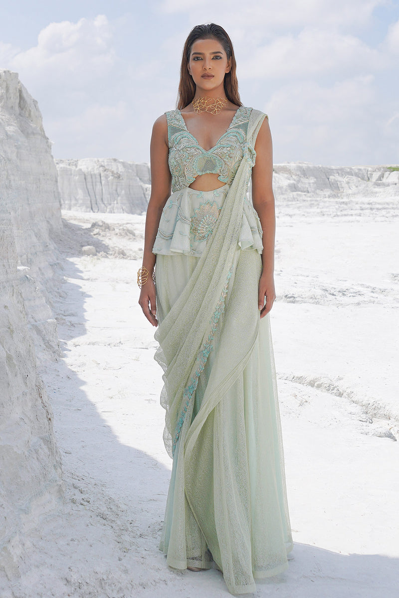 pastel green draped saree with blouse