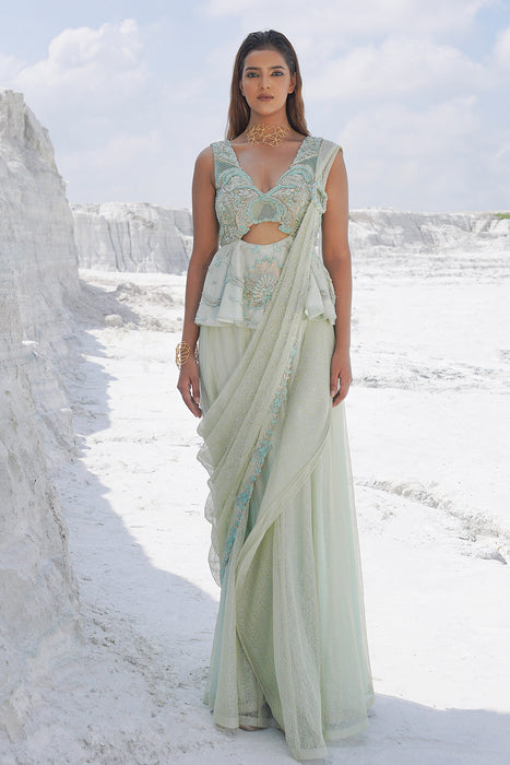 pastel green draped saree with blouse