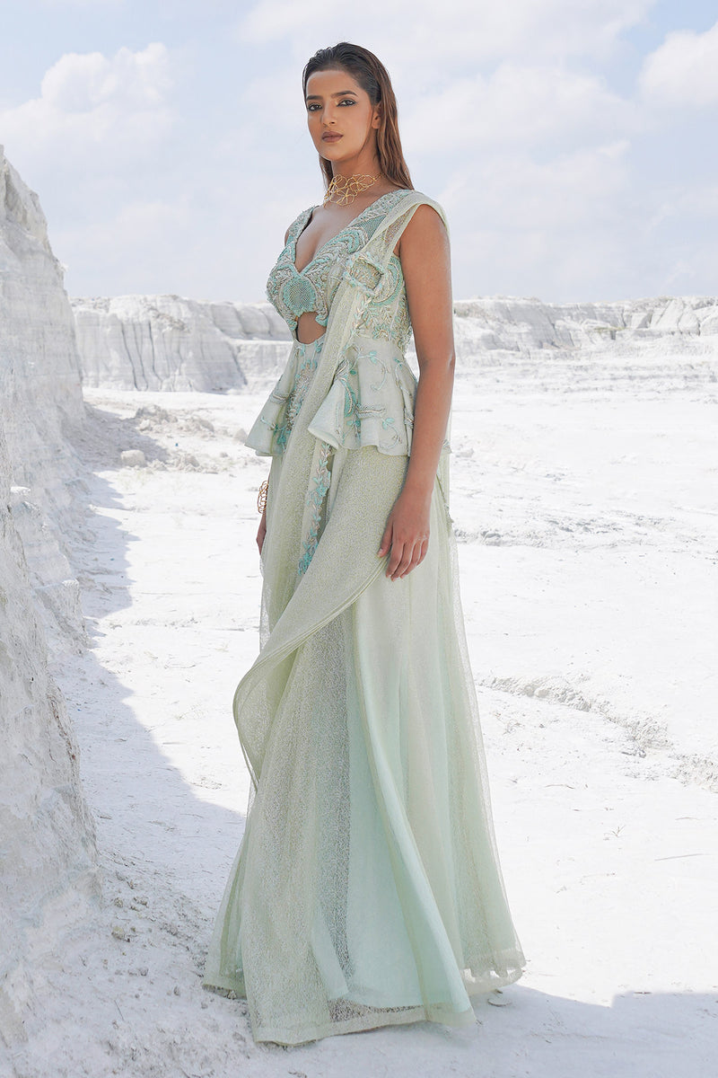pastel green draped saree with blouse
