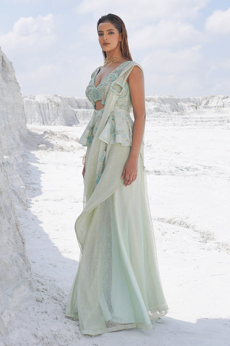 pastel green draped saree with blouse