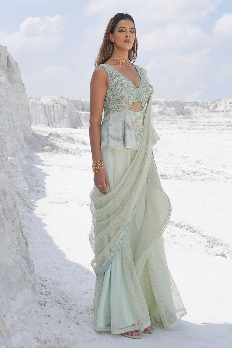 pastel green draped saree with blouse