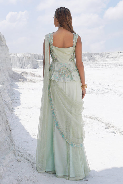 pastel green draped saree with blouse