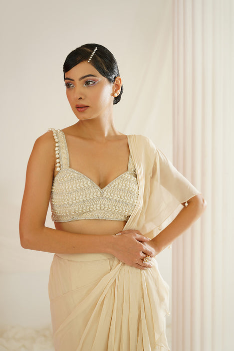 Ivory embroidered blouse with ready to wear ruffle saree set